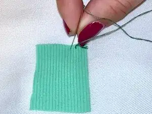 How to Hand Stitch a Patch Onto Clothing