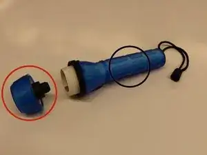 Disassembling Translucent Rubber Flashlight Battery Power Component