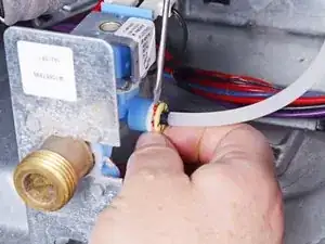 How to Disconnect the Water Tube From the Solenoid Valve on Your Whirlpool Dryer