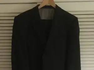 Repair cigarette burn holes in mans suit