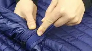 Carefully open the zip using the seam ripper.