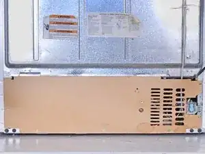 Removing the Condenser Cover of an Older Whirlpool Side‑By‑Side Refrigerator