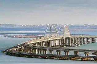 The Crimean Bridge in May 2020. The infrastructure of the Port of Taman is visible in the background.