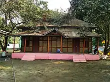 Traditional two-story tin shed house in Bangladesh