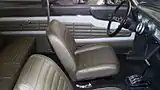 Interior of the car in the above photo with its Econoline bucket seats and later model Ford steering wheel and automatic transmission selector