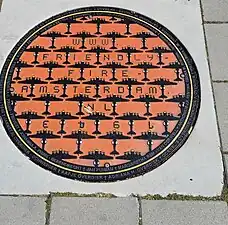 Flying Fortress B-17, artwork in the memorial manhole-series Friendly Fire (at Kraaienplein)