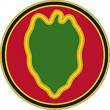 A red circle with a black outline containing a green leaf shape with a yellow outline