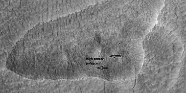 High center polygons, shown with arrows, as seen by HiRISE under HiWish program.  Location is Casius quadrangle.  Image enlarged with HiView.