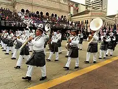 The marching band of the Royal Malaysian Police parading in ceremonial uniforms