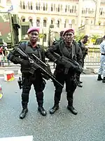 Royal Malaysian Navy PASKAL operators on standby during the 59th National Day Parade of Malaysia at Merdeka Square, Kuala Lumpur. One is armed with a 7.62mm HK417 Sniper Rifle (left), with a 8X scope attached, mounted backwards.