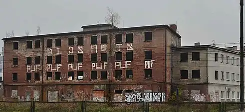 Derelict building facing the railway tracks