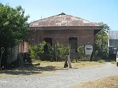 The rear of the station. Also partially seen is a column of the Northrail project.