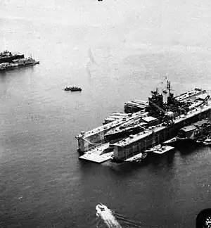 USS ABSD-5 at Manicani Island, Philippines repairing USS Mississippi in July 1945