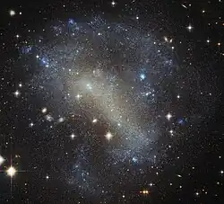 IC 4710 lies roughly 25 million light-years away in the southern constellation of Pavo.