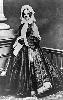 Abigail Fillmore standing, wearing a large dress