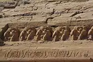 Baboon carvings above the heads of the statues of Ramses at the Great Temple