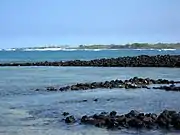 ʻAiʻopio Fish trap at Honokōhau viewed from the beach