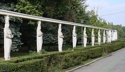 Neoclassical caryatids of the Alley of Caryatids in the Herăstrău Park, Bucharest, dressed like Romanian peasant women, sculpted by Constantin Ricci, 1939