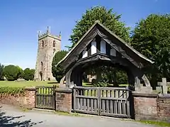 Lychgate and west tower ofAll Saints' parish church.