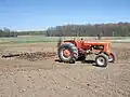 A-C Model D17 pulling a 12' Spring-Tooth Harrow