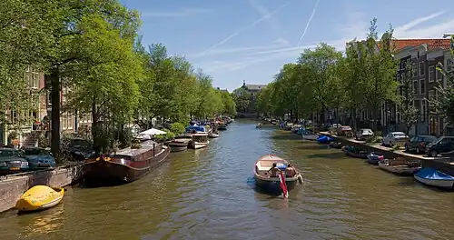 Image 9AmsterdamPhoto credit: DiliffA stitched panorama of a canal in the city of Amsterdam, the capital of the Netherlands. A series of concentric, semi-circular canals ("grachten") were dug around the old city centre in the 17th century, along which houses and warehouses were built. The canals still define Amsterdam's layout and appearance today.More selected pictures