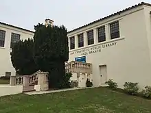 Exterior of the Anza Branch Library, showing a brick-and-concrete staircase entrance.