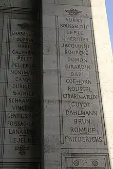 Photo shows Columns 19 and 20 under the Arc de Triomphe in Paris. There is a list of French-sounding names.