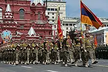 Colonel Ashot Hakobyan leading the contingent from the Armenian Armed Forces during the 2015 Moscow Victory Day Parade. Being a graduate at the school, he participated in Soviet-era parades on the square.