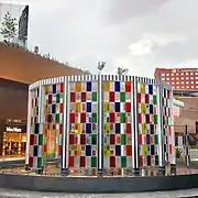 Sculpture De la rotonda a la fuente ("From the roundabout to the fountain") by Daniel Buren at valet parking area, ground floor