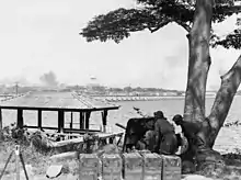 Image 59Australian anti-tank gunners overlooking the Johor Causeway between Singapore and Malaya in February 1942 (from Military history of Australia during World War II)