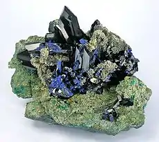 Very large cluster of azurite crystals, ex-Smithsonian collection, offered at US$125,000. Size 16.7 x 13.2 x 10.5 cm.