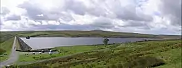 A reservoir surrounded by upland grass and heather