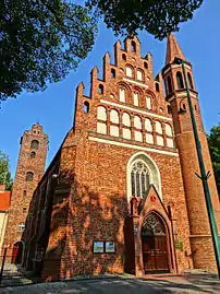 Main elevation with church tower in the backdrop