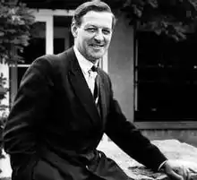 portrait of Bernard Rose wearing a suit and smiling