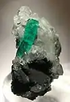 Muzo emerald on calcite5.3 cm × 3 cm × 3 cm (2.1 in × 1.2 in × 1.2 in)