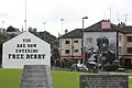 View of the corner from the Hunger Strike memorial, showing the "petrol bomber" mural.