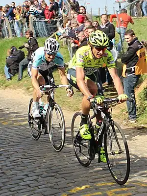 Filippo Pozzato and Tom Boonen riding up Oude Kwaremont in the 2012 Tour of Flanders