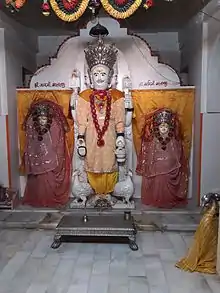 Idol of Brahma and his two consorts  Gayatri and Savitri