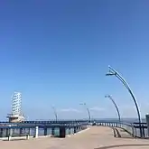 The wallkway and the beacon from the pier