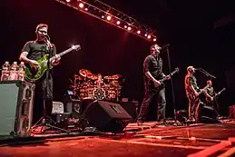 Breaking Benjamin performing in 2015. From left to right, Keith Wallen, Shaun Foist, Benjamin Burnley, Aaron Bruch, and Jasen Rauch.