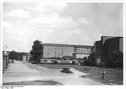 A open area with a large building structure in the background