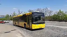 Black-and-yellow bus in traffic