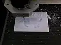 CNC machine cutting lithophane of a cat