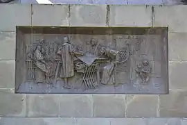 One of the basement's bronze reliefs