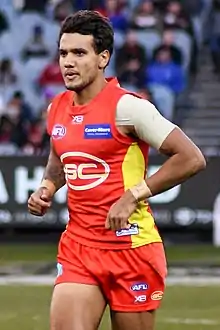 Callum Ah Chee playing for the Gold Coast Football Club in 2018