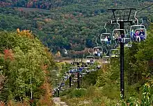 Top of the chairlift carrying visitors during fall