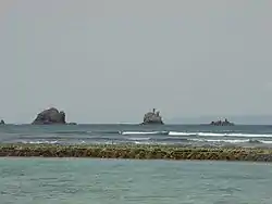 A view across the lagoon to Gili Tepekong, Gili Biaha, and Gili Mimpang, (now called Gili Trawangan) three uninhabited islands popular with divers and local fishermen.