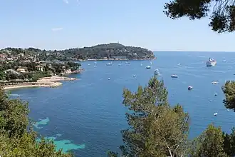 view of leafy promontory into the Mediterranean Sea