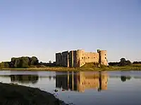 Domestic Tudor-period ranges from across the mill pond to the north west