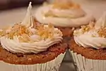 Carrot cake cupcakes with candied ginger icing